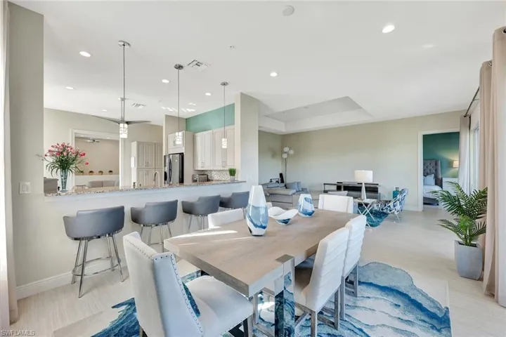 The dining area and living area both open via sliders to the 340 SF lanai and THOSE views!