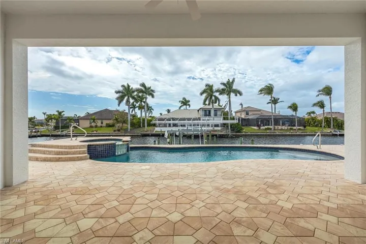 View of pool featuring a patio area and an in ground hot tub