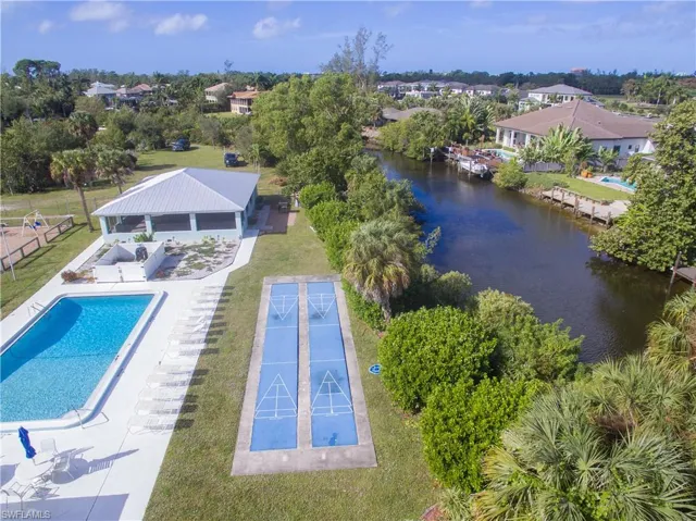 View of swimming pool featuring a water view