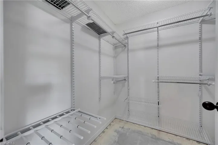 View of spacious master walk in closet