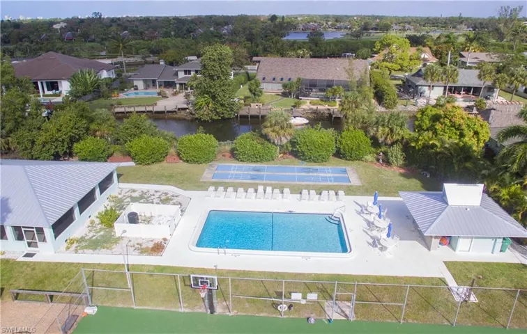 View of swimming pool featuring a patio area and a lawn