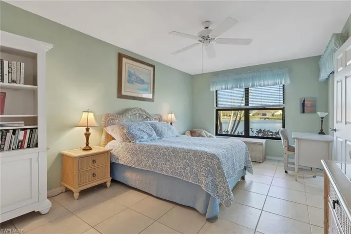 Huge primary bedroom with a lake view