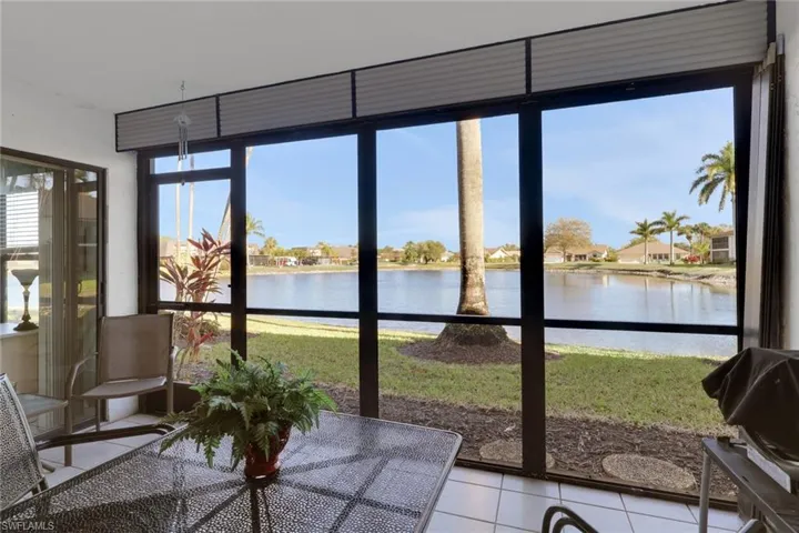 Lanai with a water view and a residential view