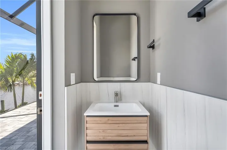 Bathroom with a water view, plenty of natural light, and vanity