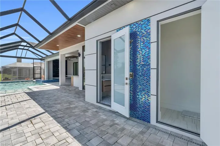 View of patio / terrace with glass enclosure and ceiling fan