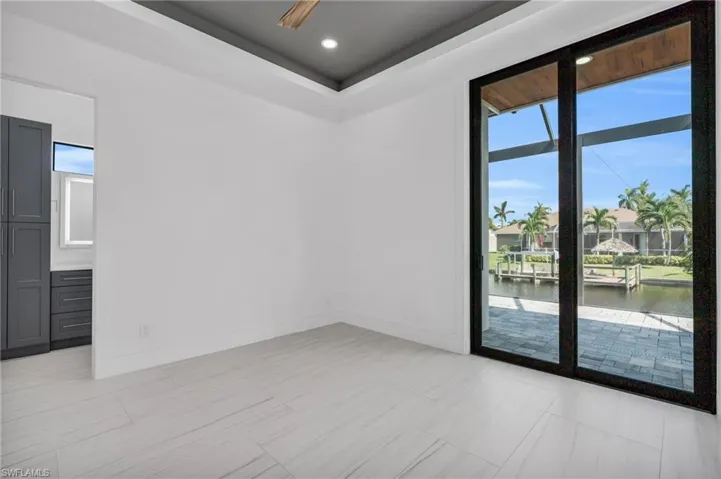 Spare room with a water view and a wealth of natural light