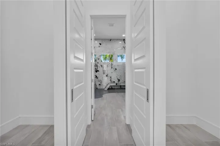 Hall featuring light wood-type flooring