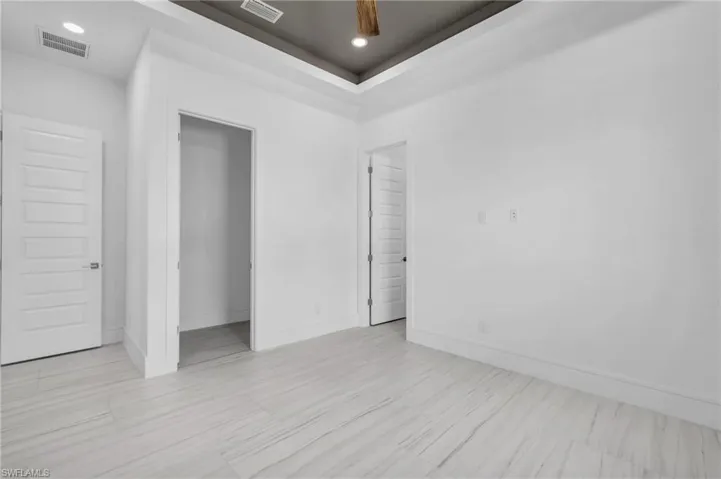 Spare room with a tray ceiling