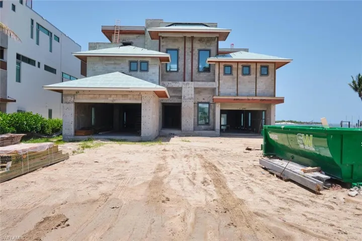 View of front facade featuring a garage