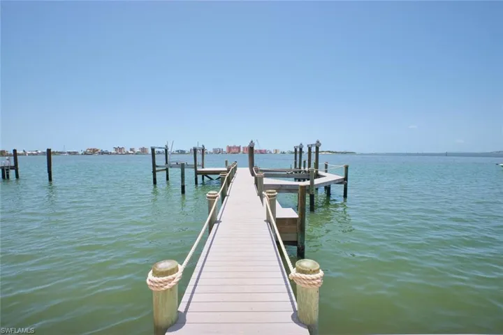 Dock area with a water view and boat lift