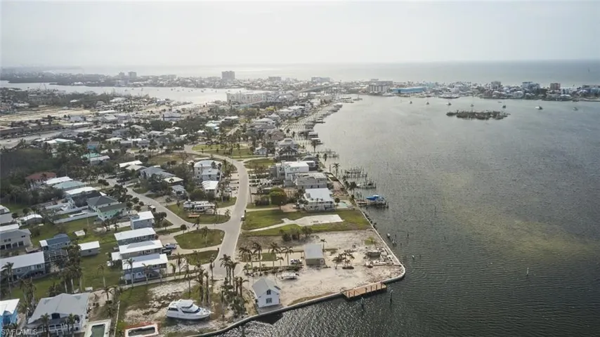 Aerial overview of property's location featuring a nearby body of water