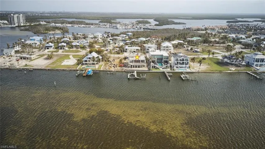 Aerial view of residential area with a nearby body of water