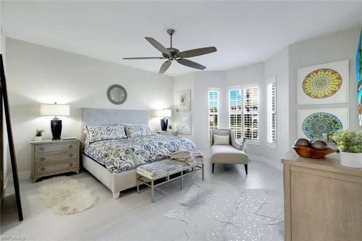 Bedroom with ceiling fan and wood finished floors