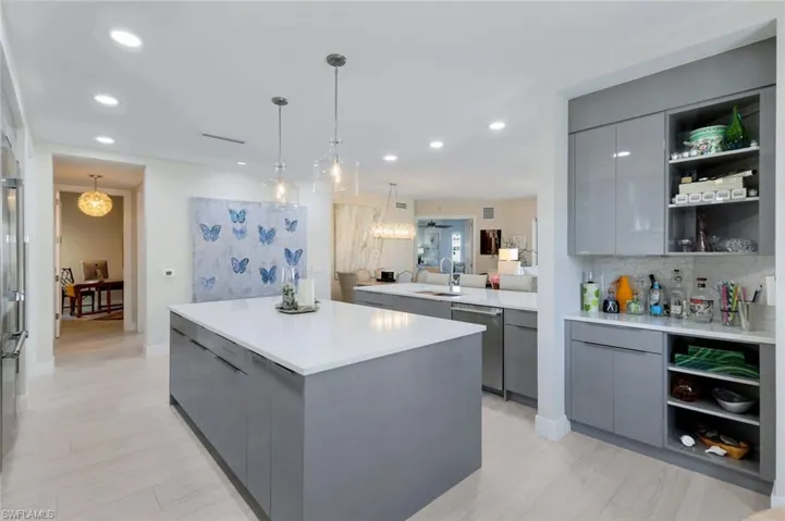 Kitchen with open shelves, gray cabinets, modern cabinets, and recessed lighting