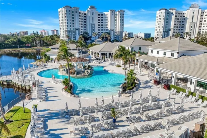 Community pool featuring a patio area and a view of city