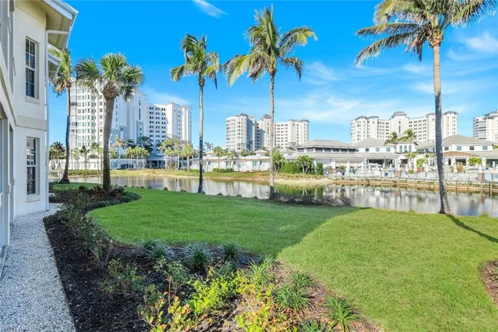 View of green lawn with a water view