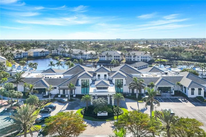 Aerial perspective of suburban area with a nearby body of water