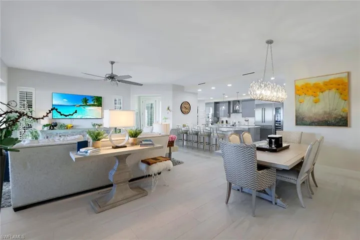 Dining area with recessed lighting, a ceiling fan, and light wood-style floors
