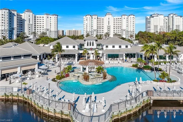 Community pool with a city view and a patio