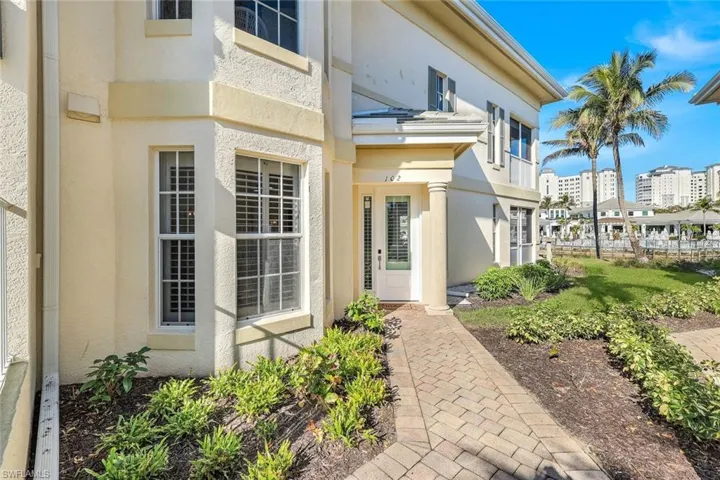 Property entrance featuring stucco siding