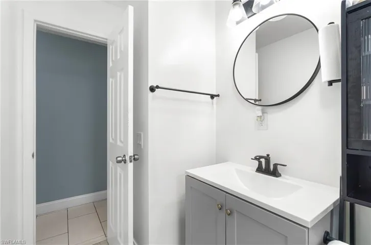 Bathroom featuring vanity and light tile patterned floors