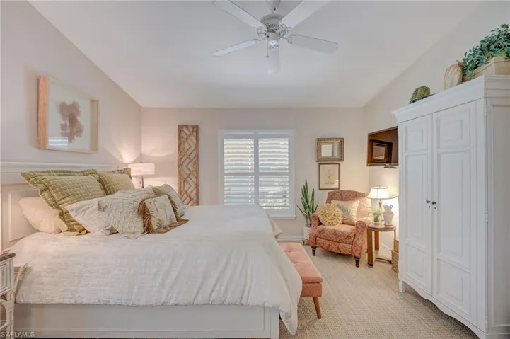 Primary bedroom view is lush tropical trees and large lanai space