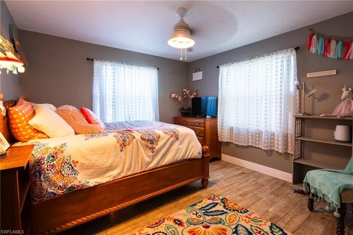Bedroom featuring ceiling fan and light hardwood / wood-style floors