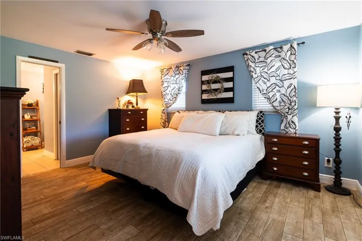 Bedroom featuring hardwood / wood-style flooring and ceiling fan