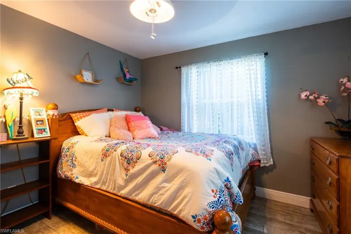 Bedroom featuring hardwood / wood-style flooring and ceiling fan
