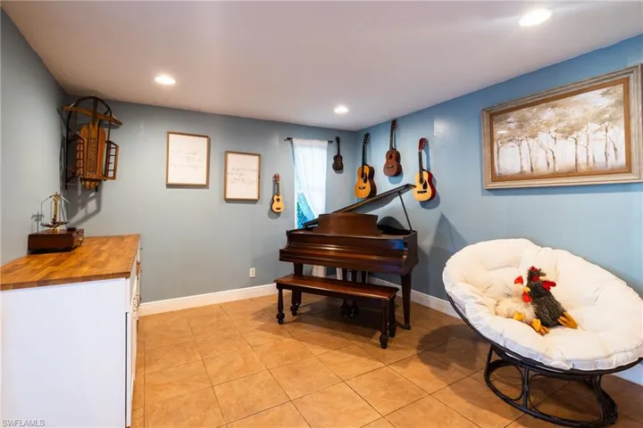 Misc room with light tile patterned floors