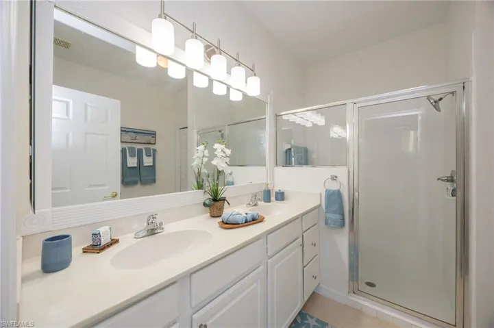 New vanity lighting and framed mirror