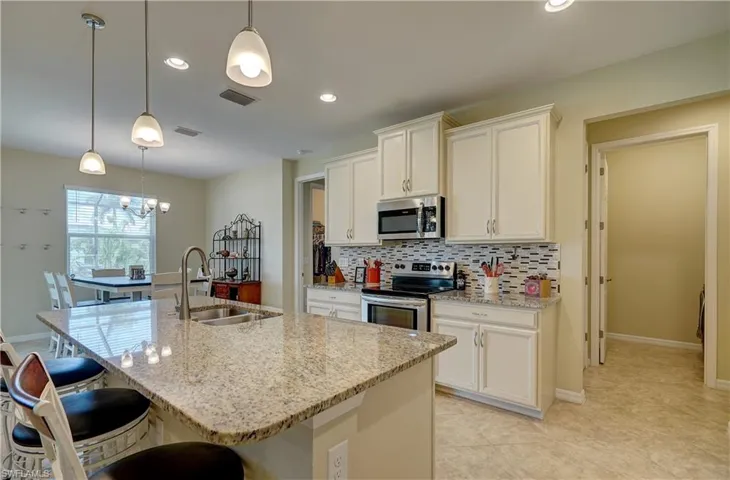 Stainless steel appliances. Easy serving to the dining area, or eat at the island.