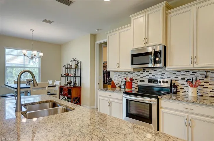 Convenient layout with a large island makes cooking or baking a pleasure in this kitchen!