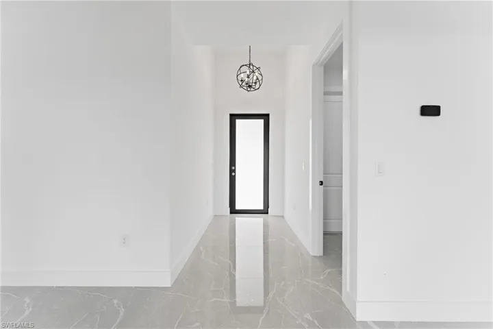 Entryway featuring an inviting chandelier