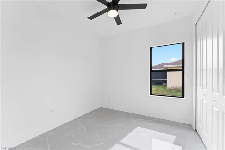 Unfurnished room with ceiling fan