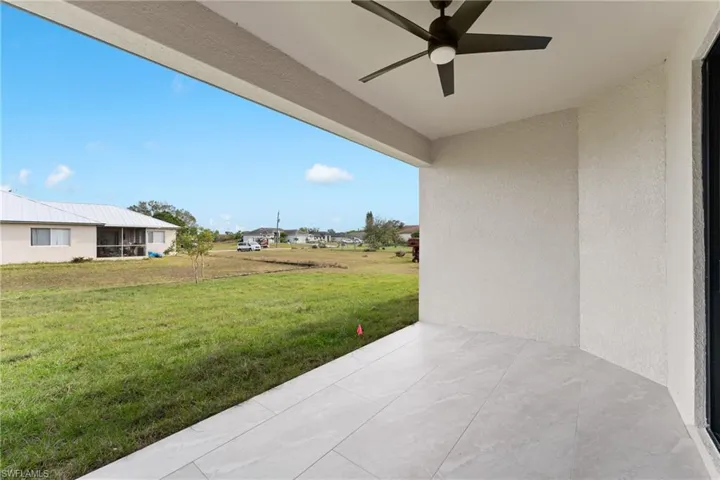 View of patio featuring ceiling fan