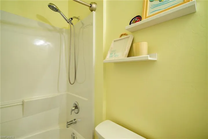 The guest bathroom with a tub/shower combo