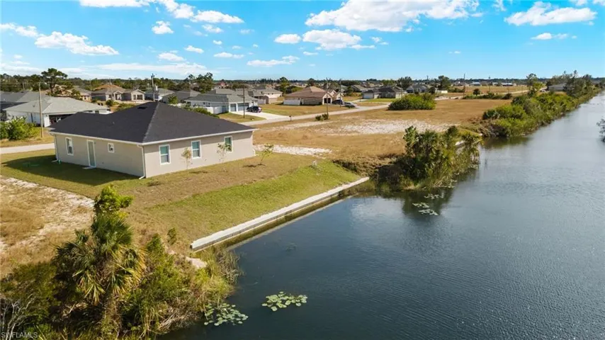 Aerial view of residential area with a nearby body of water