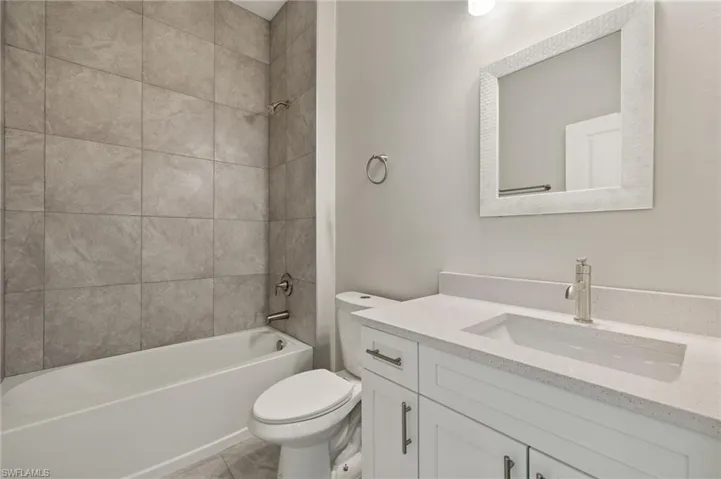 Full bathroom with shower / bathtub combination and vanity