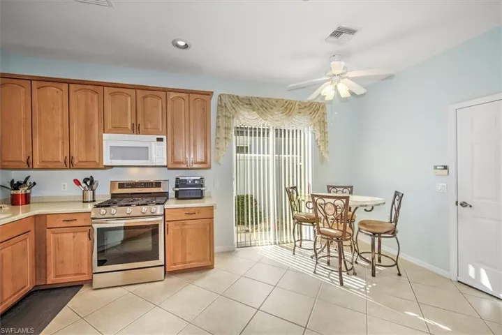 Kitchen with GAS cooking and lighted ceiling fan!