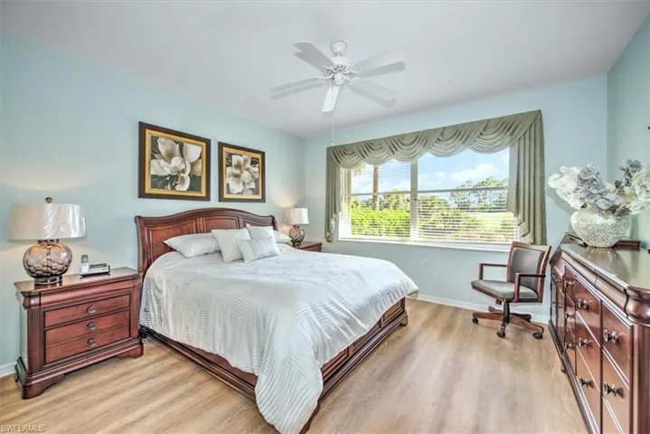 Master bedroom w/easy-care laminate flooring and ceiling fan!
