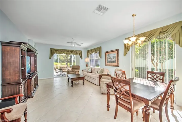 Open concept dining room featuring chandelier!
