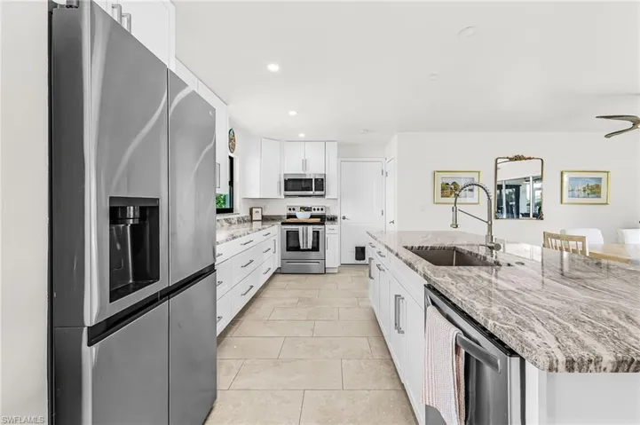 Great new kitchen with door to garage and open to living/dining area