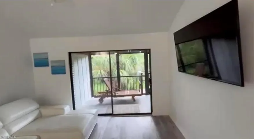 Doorway to outside featuring wood finished floors