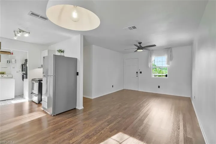 Laundry off kitchen opens to back porch