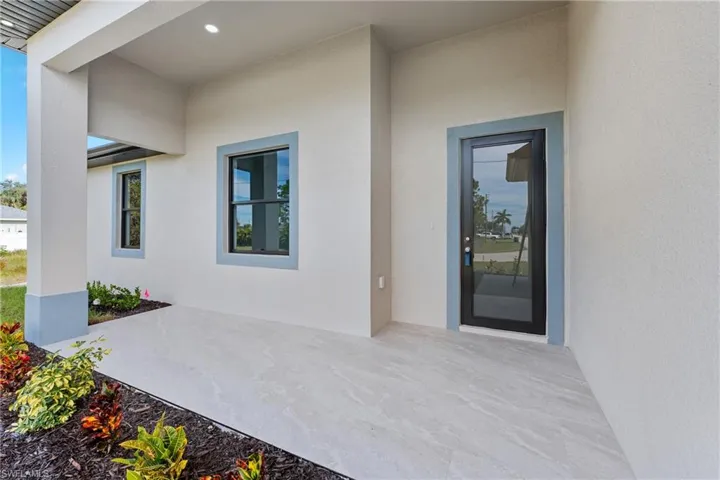 Property entrance featuring a patio