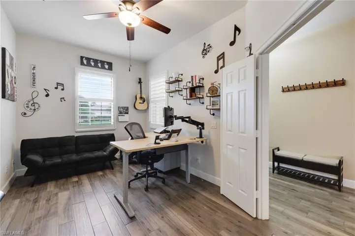 Office featuring ceiling fan and wood-style floors
