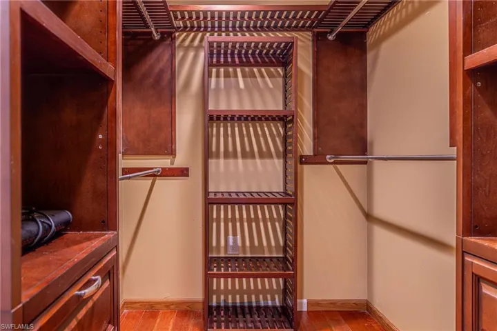 Spacious closet featuring wood finished floors