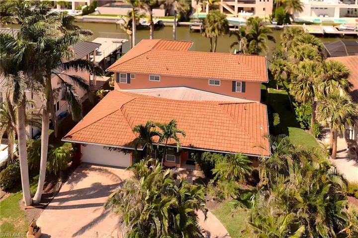 Drone / aerial view featuring a water view and a residential view