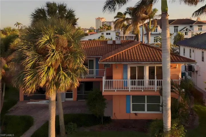 View of property at dusk
